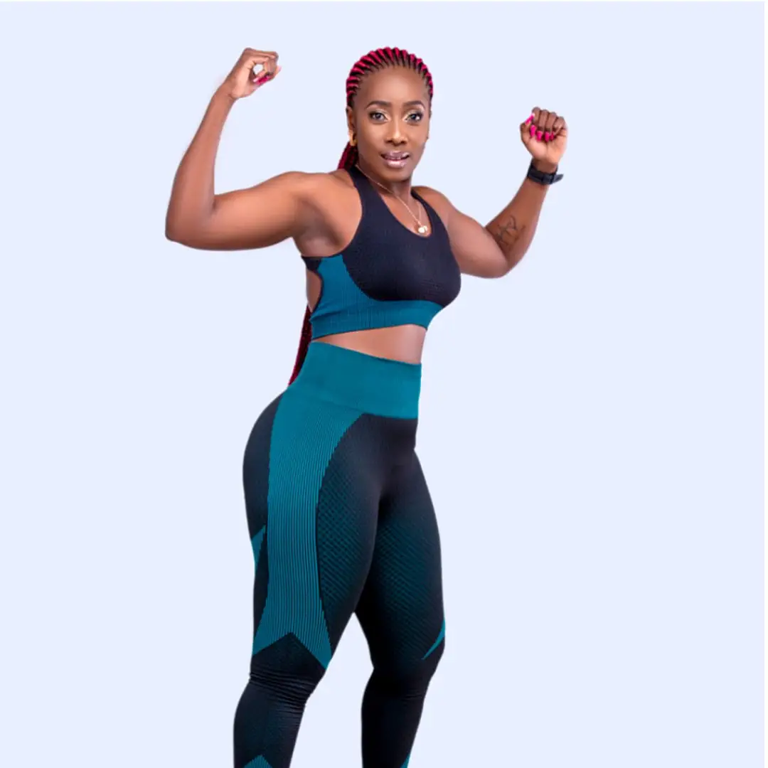 Merceline in fitness gear demonstrating strength and confidence